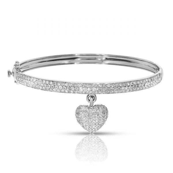 Immerse in celestial splendor with the 'Heart of the Cosmos' Diamond Bangle Bracelet adorned with round-cut diamonds. Perfect for anniversaries or gestures of affection.