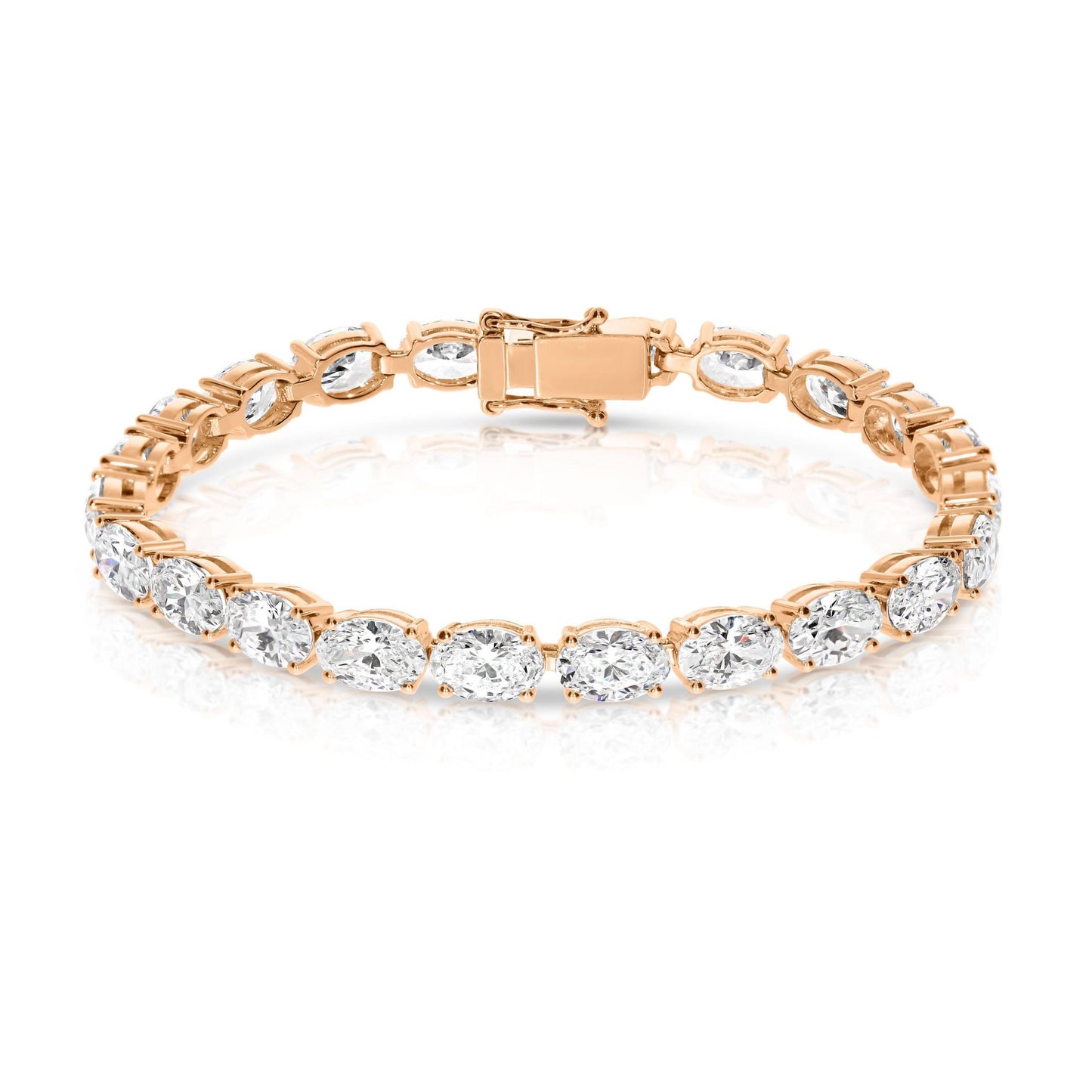 The "Eclipse Radiance" Gold tennis bracelet is a celestial symphony in motion, echoing the ethereal allure of a lunar eclipse. Lined with captivating oval-cut diamonds, it symbolizes elegance and timelessness.