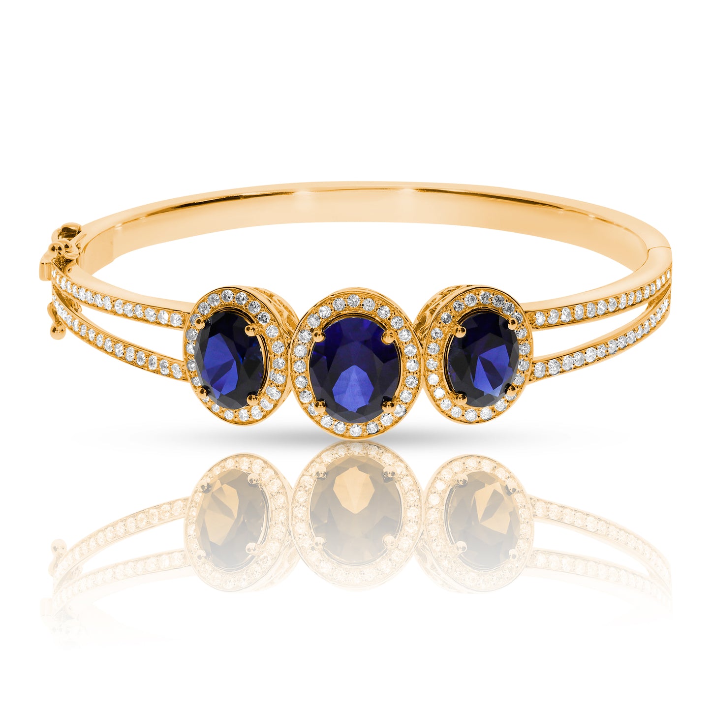Experience cosmic elegance with the Celestial Tranquility gold bangle. Featuring mesmerizing oval sapphires and round-cut diamonds, it's perfect for milestone celebrations or as a meaningful gift for the peace bringer in your life.