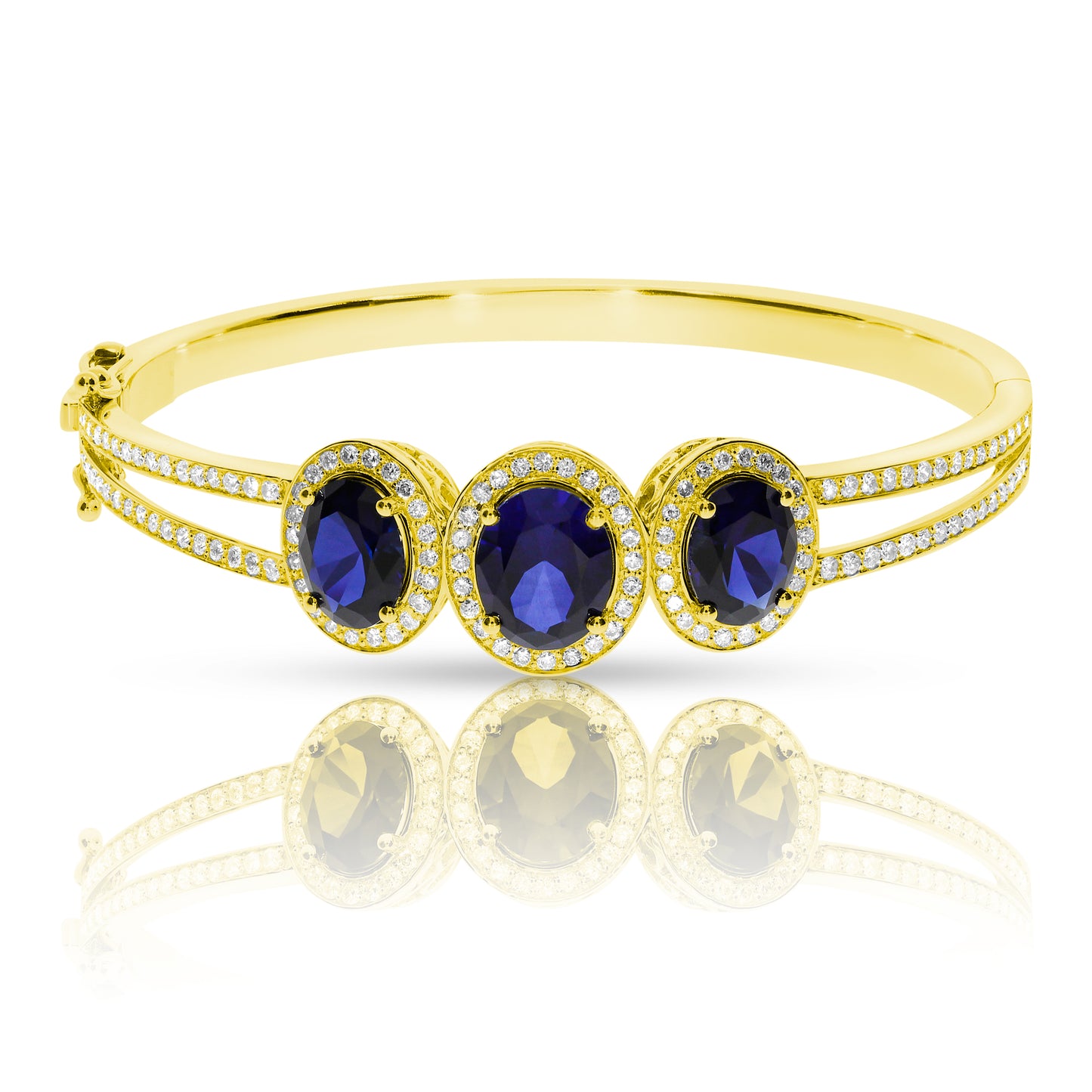 Experience cosmic elegance with the Celestial Tranquility gold bangle. Featuring mesmerizing oval sapphires and round-cut diamonds, it's perfect for milestone celebrations or as a meaningful gift for the peace bringer in your life.