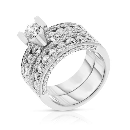Embodying the enchanting radiance of the cosmos, the Celestial Glow Sidestone Ring in gold showcases a round-cut diamond surrounded by a halo of shimmer, capturing the celestial elegance of the night sky. Perfect for life's milestones.