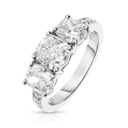 Discover the mystical allure of the Celestial Trio Gold Sidestone Ring. Featuring three cushion-cut diamonds that symbolize the past, present, and future, this ring epitomizes eternal love. A perfect choice for engagements, anniversaries, or commemorating significant life moments.