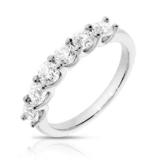 Embrace the everlasting bond of love with the 'Circle of Light.' This eternity ring in gold features a continuous band of round-cut diamonds, perfect for anniversaries or timeless connections.