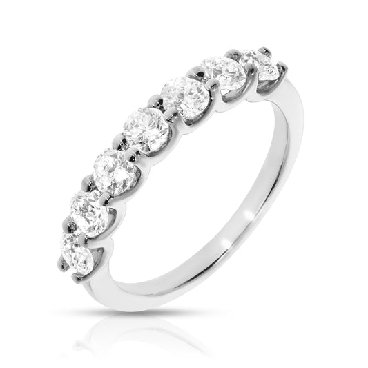 Embrace love with the Celestial Harmony eternity ring, featuring round-cut diamonds in gold. A symbol of enduring relationships and timeless elegance.