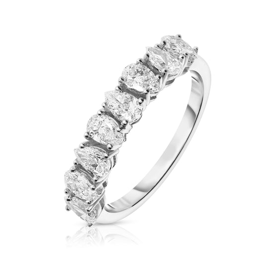 Capture endless elegance with The Celestial Journey, a gold eternity ring set with pear-cut diamonds. Available in 14K or 18K gold. Ideal for anniversaries or lifelong vows.