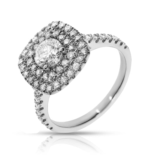 Experience heavenly beauty with the Celestial Halo ring. Crafted in polished gold, it features shimmering diamonds and a central star-like diamond. Perfect for commemorating life's special moments.