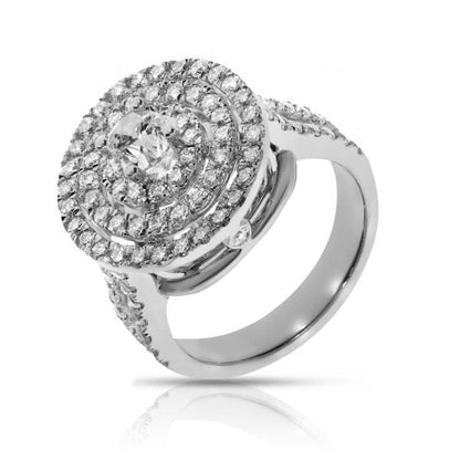 Revel in the harmonious beauty of the cosmos with our "The Celestial Chorus" diamond halo ring. This masterpiece showcases a central round-cut diamond, radiating brilliance, encircled by a celestial halo of glittering diamonds. Expertly crafted in lustrous gold, this ring stands as a beacon of elegance and timeless sophistication. Ideal for commemorating a beloved partner or as a radiant token of self-celebration.