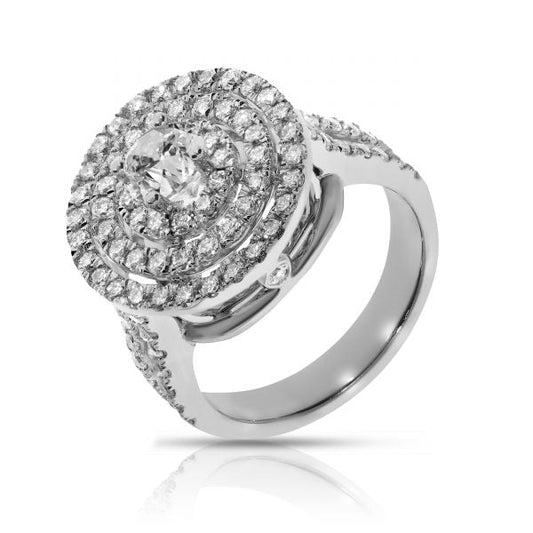 Revel in the harmonious beauty of the cosmos with our "The Celestial Chorus" diamond halo ring. This masterpiece showcases a central round-cut diamond, radiating brilliance, encircled by a celestial halo of glittering diamonds. Expertly crafted in lustrous gold, this ring stands as a beacon of elegance and timeless sophistication. Ideal for commemorating a beloved partner or as a radiant token of self-celebration.