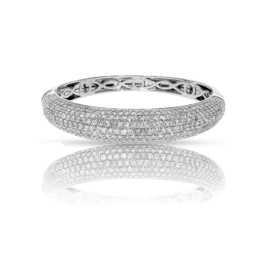 Adorn your wrist with Cosmic Halo, a bangle bracelet of round-cut diamonds. Available in 14K or 18K gold. Ideal for milestone gifts or personal elegance.