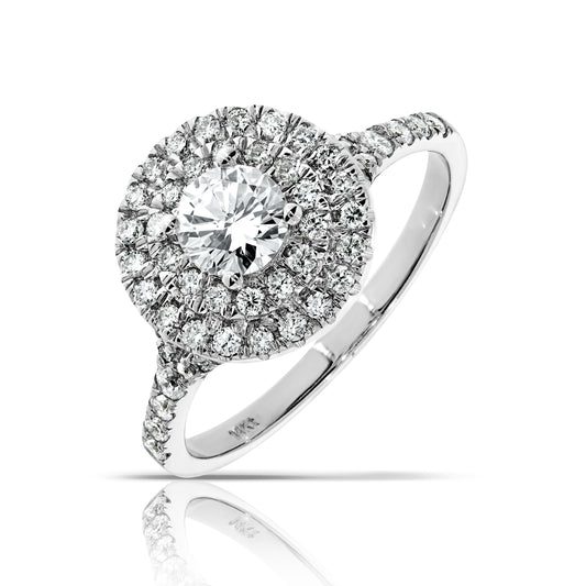 Capture the cosmos with the "Eternal Orbit" halo ring, featuring a radiant diamond surrounded by a shimmering gold halo. Ideal for anniversaries.