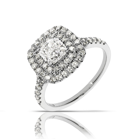 The Eclipse of Enchantment gold ring, inspired by celestial events, features a cushion-cut diamond and a sparkling halo. Perfect for life's precious milestones.
