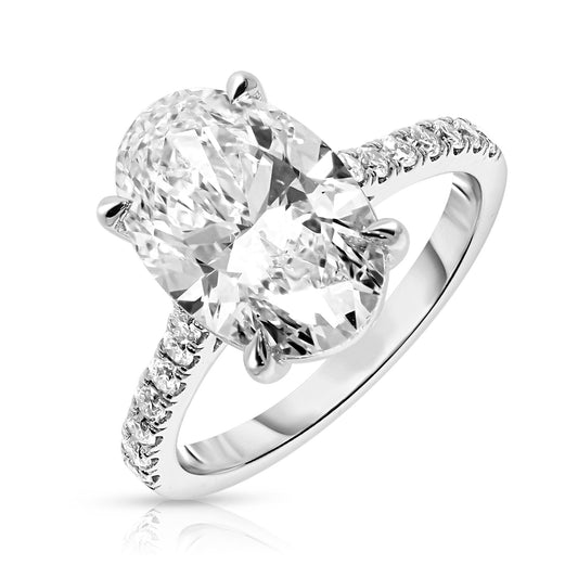 Embrace the ethereal charm of celestial wonders with the 'Celestial Promise.' This Gold sidestone ring is crowned by an enchanting oval diamond, reflecting the timeless beauty of a radiant celestial body. Encircled by sidestones that sparkle like steadfast constellations, this piece promises a lifetime of devotion and heartfelt memories. Ideal for engagements or celebrating an undying commitment, this ring is a testament to love that transcends the cosmos.