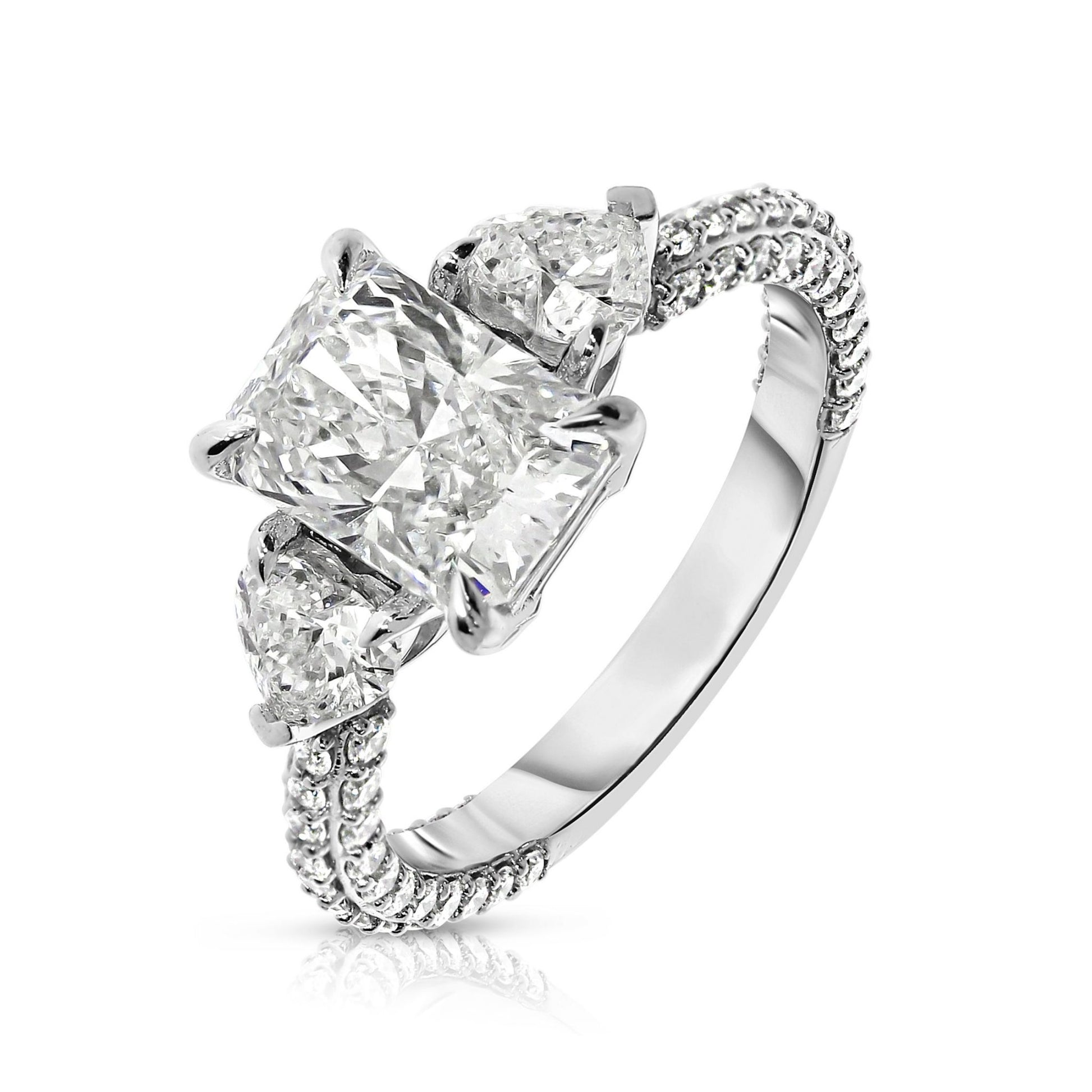 Discover "The Celestial Triad," an exquisite ring with two sidestone emerald-cut diamonds, symbolizing cosmic harmony. Crafted from Gold, it captures light uniquely. Ideal for celebrating unions or personal milestones with elegance.