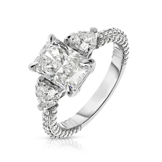 Discover "The Celestial Triad," an exquisite ring with two sidestone emerald-cut diamonds, symbolizing cosmic harmony. Crafted from Gold, it captures light uniquely. Ideal for celebrating unions or personal milestones with elegance.