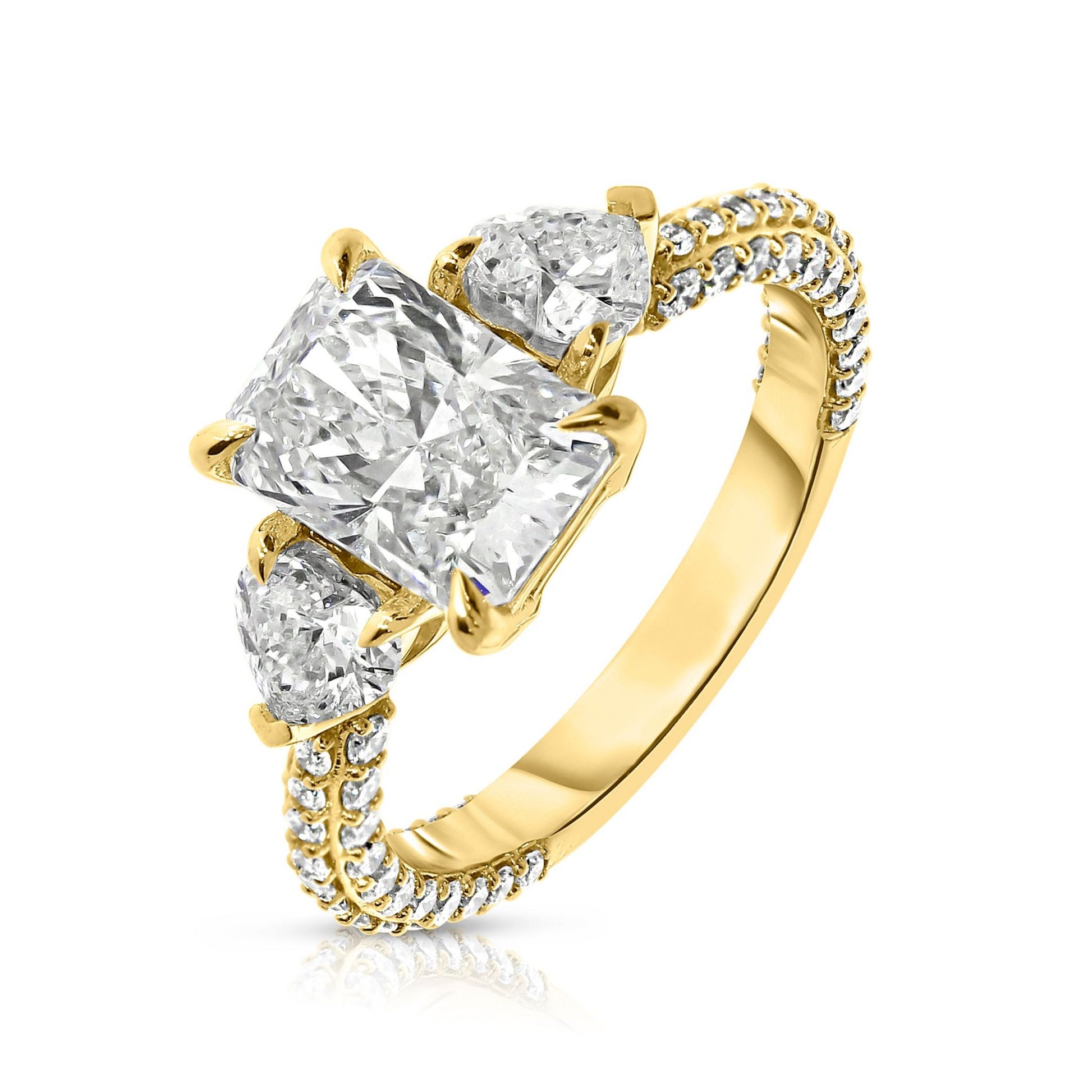 Discover "The Celestial Triad," an exquisite ring with two sidestone emerald-cut diamonds, symbolizing cosmic harmony. Crafted from Gold, it captures light uniquely. Ideal for celebrating unions or personal milestones with elegance.