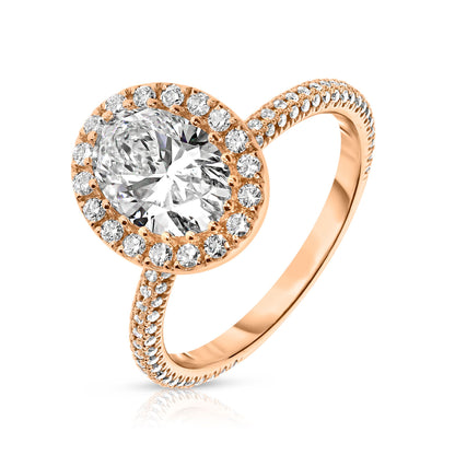 Experience the majesty of the cosmos with the "Celestial Aura" ring, featuring an oval diamond framed by a halo in gold. Perfect for engagement or as a symbol of love.