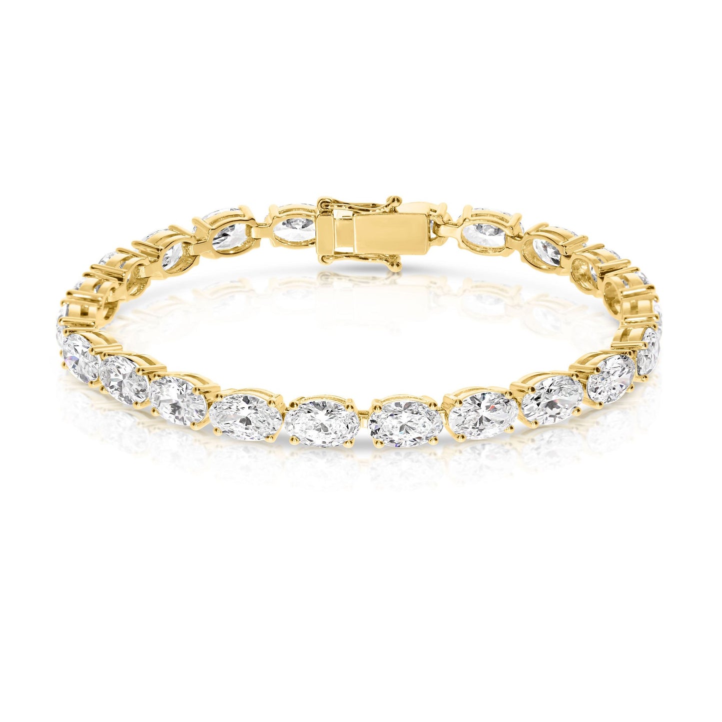 The "Eclipse Radiance" Gold tennis bracelet is a celestial symphony in motion, echoing the ethereal allure of a lunar eclipse. Lined with captivating oval-cut diamonds, it symbolizes elegance and timelessness.
