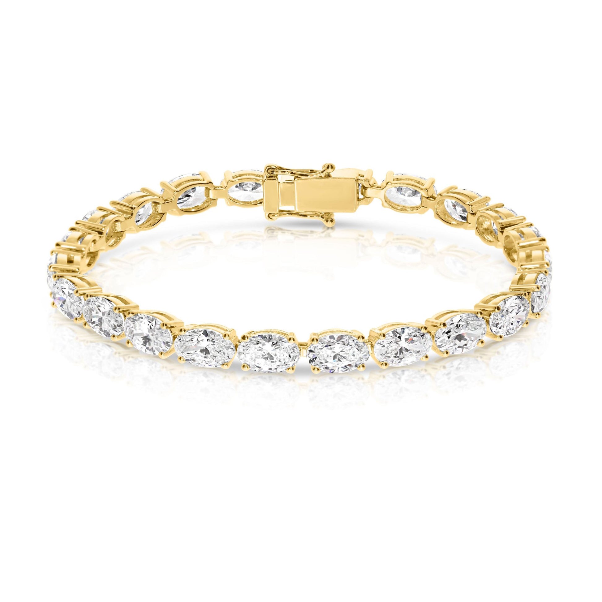 The "Eclipse Radiance" Gold tennis bracelet is a celestial symphony in motion, echoing the ethereal allure of a lunar eclipse. Lined with captivating oval-cut diamonds, it symbolizes elegance and timelessness.
