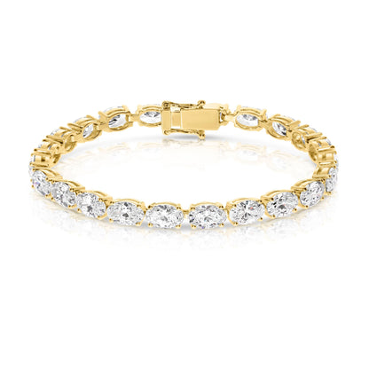 The "Eclipse Radiance" Gold tennis bracelet is a celestial symphony in motion, echoing the ethereal allure of a lunar eclipse. Lined with captivating oval-cut diamonds, it symbolizes elegance and timelessness.
