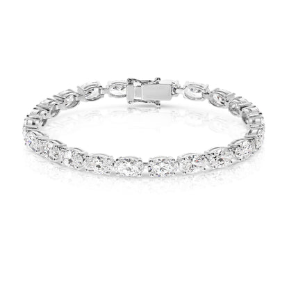 The "Eclipse Radiance" Gold tennis bracelet is a celestial symphony in motion, echoing the ethereal allure of a lunar eclipse. Lined with captivating oval-cut diamonds, it symbolizes elegance and timelessness.