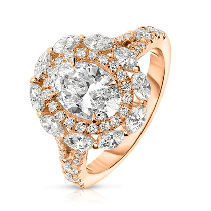 Embodying the ethereal beauty of the cosmos, the "Heaven's Embrace" Gold halo ring showcases an exquisite oval diamond, capturing celestial glow of a tranquil night sky. Encircled by a halo of shimmering round-cut diamonds, it's a symbol of eternal grace. Perfect for engagements, anniversaries, or self-adornment.