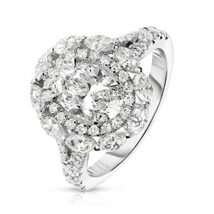Embodying the ethereal beauty of the cosmos, the "Heaven's Embrace" Gold halo ring showcases an exquisite oval diamond, capturing celestial glow of a tranquil night sky. Encircled by a halo of shimmering round-cut diamonds, it's a symbol of eternal grace. Perfect for engagements, anniversaries, or self-adornment.
