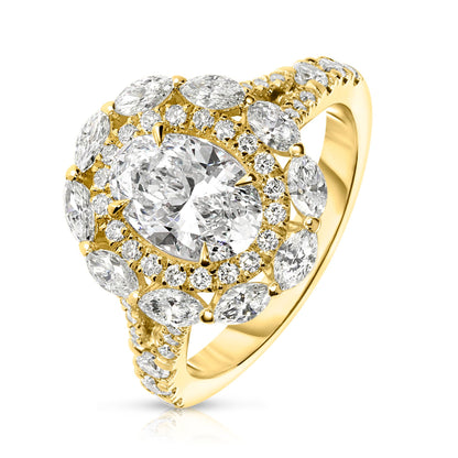 Embodying the ethereal beauty of the cosmos, the "Heaven's Embrace" Gold halo ring showcases an exquisite oval diamond, capturing celestial glow of a tranquil night sky. Encircled by a halo of shimmering round-cut diamonds, it's a symbol of eternal grace. Perfect for engagements, anniversaries, or self-adornment.
